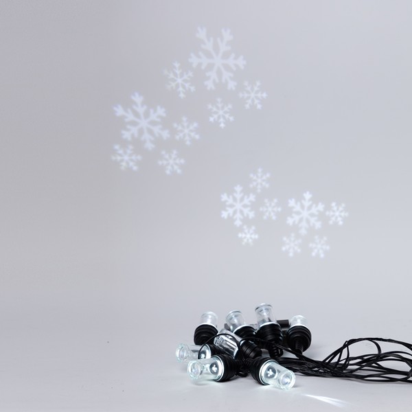 PROYECTOR GUIRNALDA 8 LED CON DISEÑO DE COPO DE NIEVE, ADAPTADOR DE 4,5V, FIJO, CABLE PVC NEGRO, LED BLANCO, POR 50cm, CABLE 5m, IP44